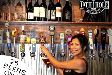 Photo of bartender and beer taps at 19th Hole Bar & Grill