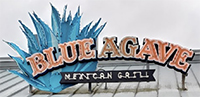 Photo of Blue Agave Mexican Grill & Tequila Bar sign on roof of building