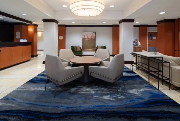 Modern lobby seating area at Fairfield Inn & Suites Bremerton with contemporary furniture and warm lighting in downtown Bremerton, Washington.