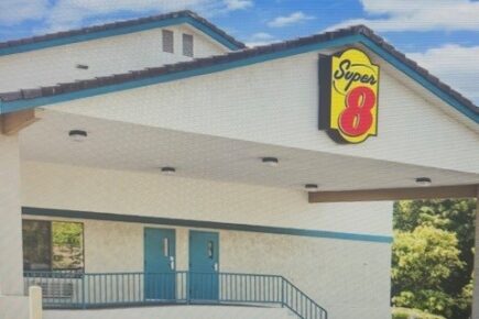 Exterior of Super 8 Bremerton hotel near Highway 3 with parking and guest entrance