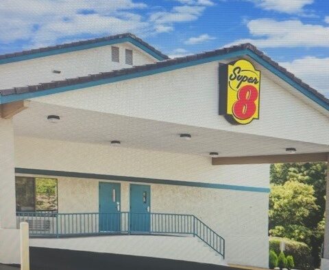 Exterior of Super 8 Bremerton hotel near Highway 3 with parking and guest entrance