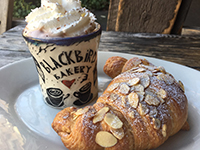 photo of baked turnover and coffee drink at Blackbird Bakery