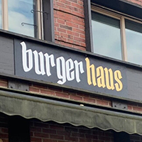 Photo of sign on exterior of Hitchcock's Burgerhaus