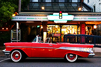 Photo of red classic car outside of Green Light Diner